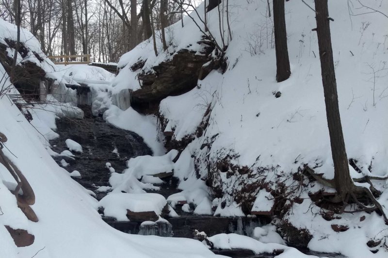 Rocky waterfall covered in snow